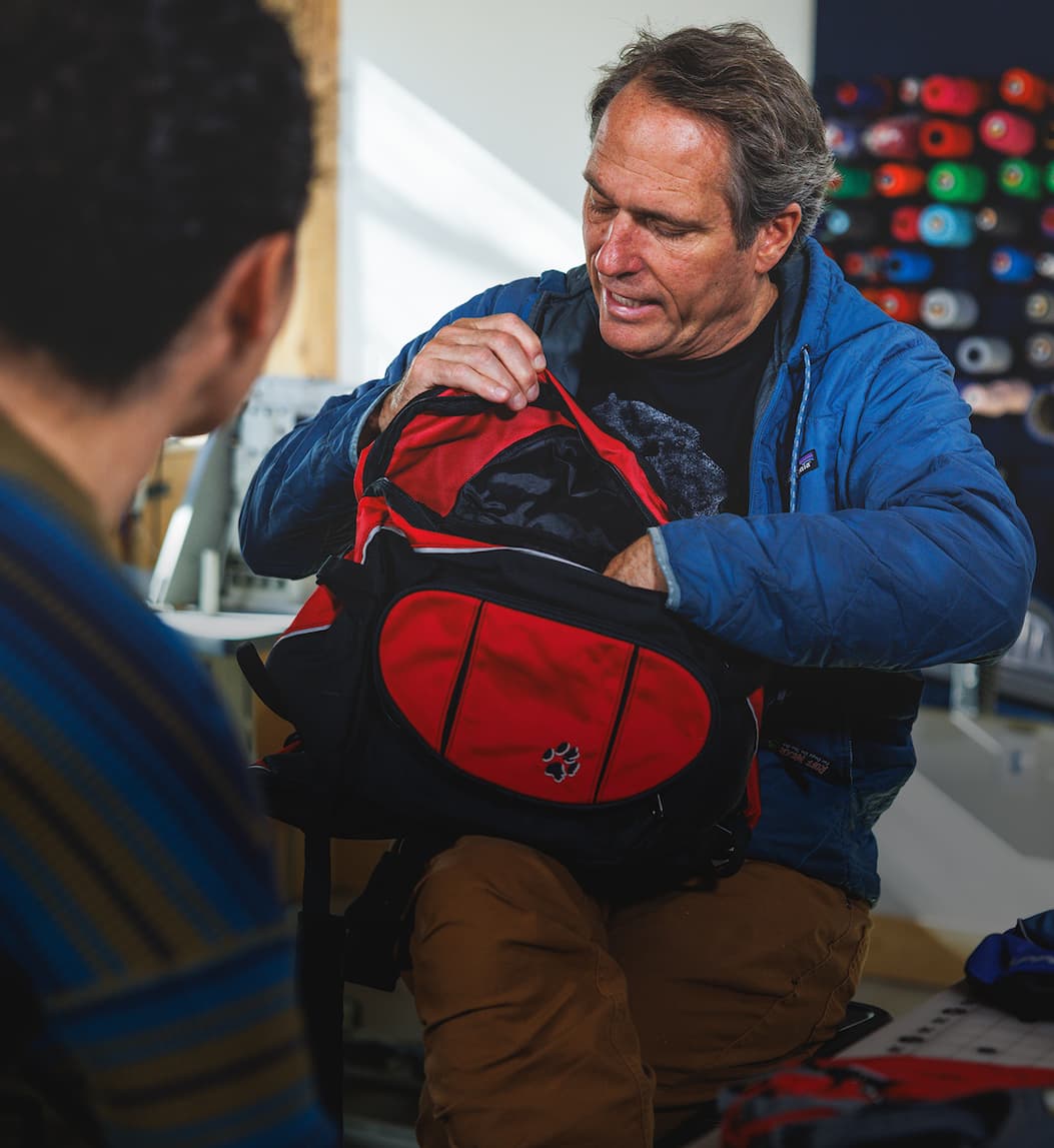 PK looks through an old Palisades Pack while talking to Cristina, our Senior Product Line Manager 